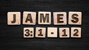 Scrabble letters on a black table spelling out James 3:1-12.